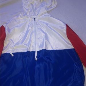 White, Blue, Red wind breaker.